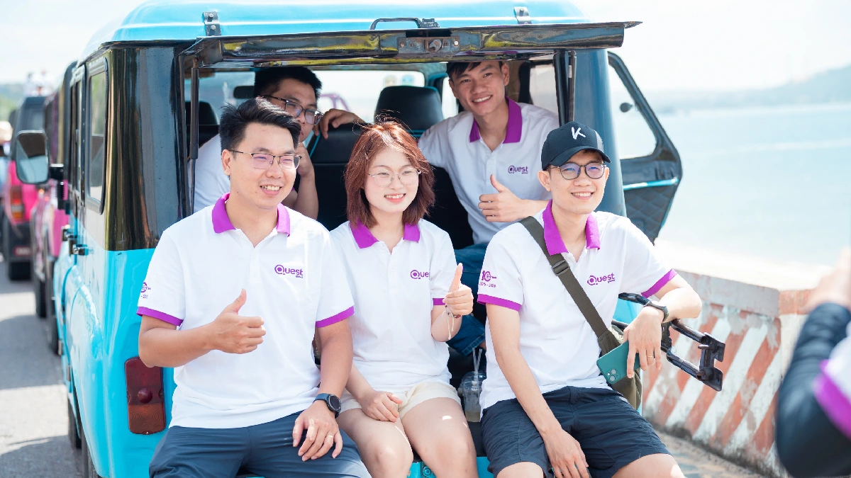 Quest Global team thumbs up