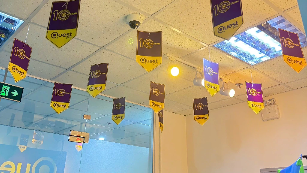 Decorated with hanging banners celebrating 10 years of Quest Vietnam
